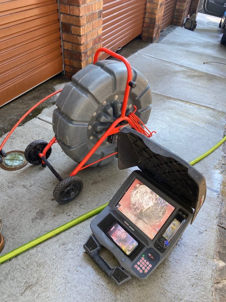 plumbers doing video pipe inspections